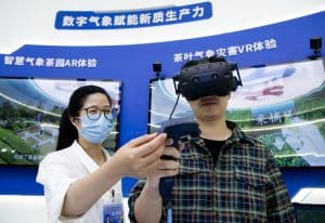 China to ramp up digital transformation: A visitor tries digital VR devices at the 7th Digital China Summit in Fuzhou, southeast China's Fujian Province, May 23, 2024. 